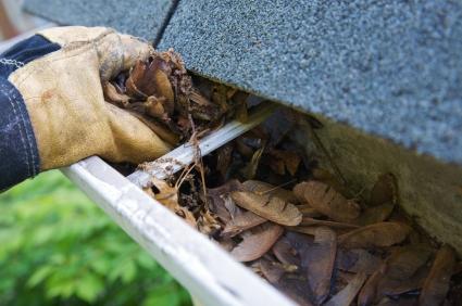 Cleaning gutters by hand