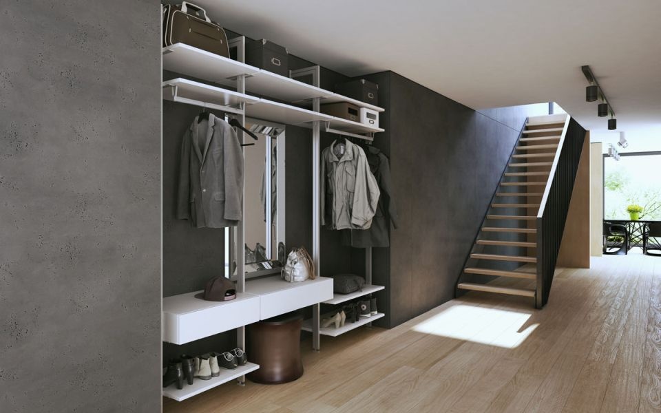 Fitted wardrobe next to a staircase leading to the next floor.