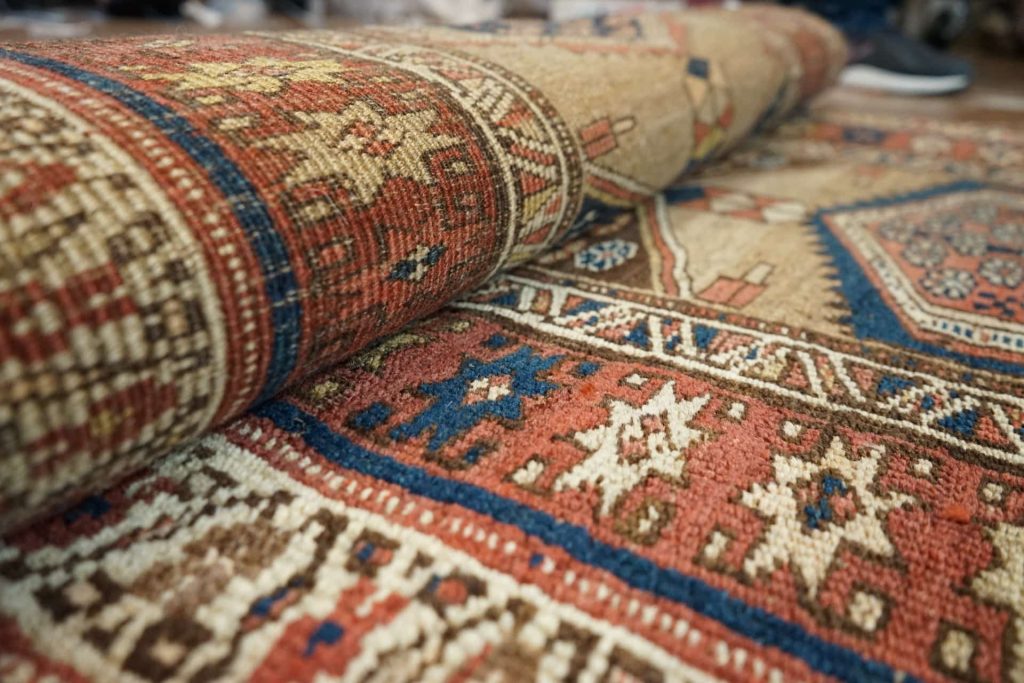 Partly rolled up oriental rug