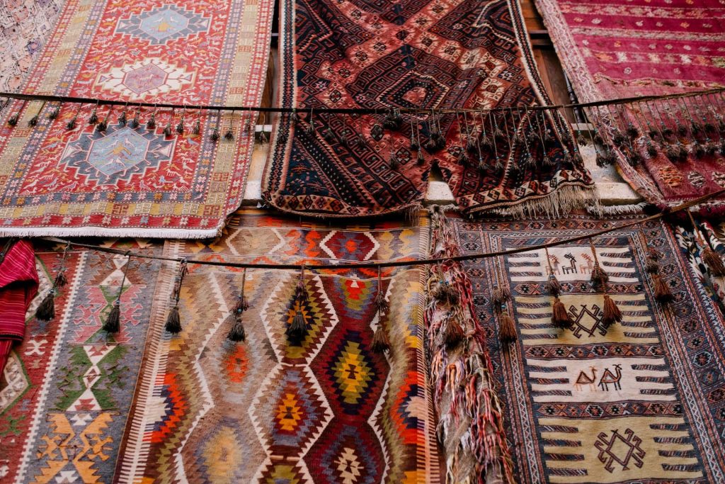 Various oriental rugs, in various states, drying.